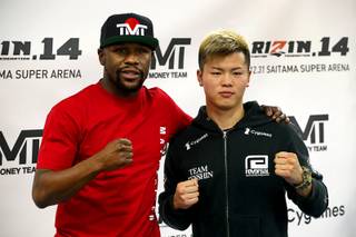 Floyd Mayweather Jr., left,poses with Japanese kickboxer Tenshin Nasukawa during a news conference at the Mayweather Boxing Club in Las Vegas Thursday, Dec. 6, 2018. Mayweather is scheduled to fight Nasukawa in a three-round exhibition match in Japan on New Year's Eve.