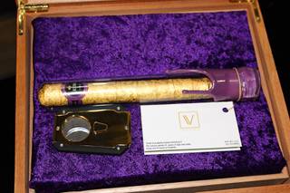 A cannabis cigar produced by Las Vegas cultivator Virtue and production company Leira rests in a wood grain case at Nuwu Cannabis Marketplace on Friday, Dec. 28, 2018. The 24-gram cannagar, wrapped in hemp and 24-karat gold leaf, was sold to Los Angeles resident Brandon Hawkins for $11,000. 