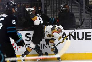 Vegas Golden Knights center Jonathan Marchessault (81) is upended by San Jose Sharks left wing Evander Kane (9) during the first period at T-Mobile Arena Thursday, Jan 10, 2019.