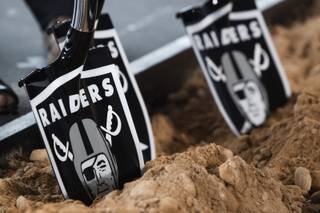 A shovel digs into dirt during a groundbreaking ceremony at the location for the new Raiders headquarters in Henderson, Monday, Jan. 14, 2019.