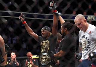 UFC light heavyweight champion Jon Jones is declared the winner over Anthony Smith, right, during UFC 235 at T-Mobile Arena Saturday, March 2, 2019. Jones retained his title by unanimous decision.