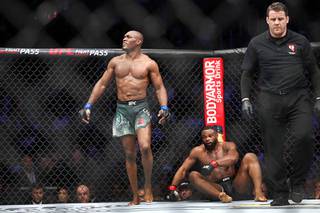Kamaru Usman walks from UFC welterweight champion Tyron Woodley at the end of the fifth round during UFC 235 at T-Mobile Arena Saturday, March 2, 2019.