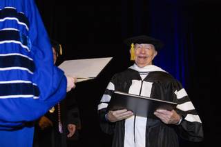 Ninety-two-year-old Holocaust survivor Daniel Szafran smiles as he receives a doctorate of humane letters degree from Touro University Nevada during a spring commencement ceremony at Westgate Monday, May 13, 2019. Twenty-one Holocaust survivors were honored Monday with the honorary degrees.