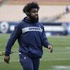 Dallas Cowboys running back Ezekiel Elliott warms up before an NFL divisional football playoff game against the Los Angeles Rams Saturday, Jan. 12, 2019, in Los Angeles.