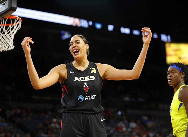 Las Vegas Aces' Liz Cambage (8) reacts after a basket during a WNBA basketball game against the Dallas Wings at the Mandalay Bay Events Center Tuesday, July 30, 2019.