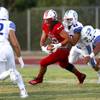 Liberty High School's Zyrus Fiaseu (30) carries the ball during a game against Chandler (Ariz.) High School in Henderson Friday, Aug. 23, 2019.