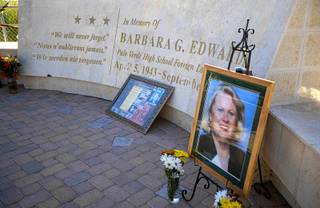 A portrait and flowers are displayed before an annual rededication ceremony for the Barbara G. Edwards Memorial at Palo Verde High School Wednesday, Sept. 11, 2019.  Edwards, a Palo Verde foreign language teacher, was a passenger on American Airlines Flight 77 and died when the plane was crashed into the Pentagon on 9/11.