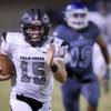 Palo Verde quarterback Paul Myro (15) gets past the Green Valley defense during a game at Green Valley High School in Henderson, Friday, Sept. 13, 2019.