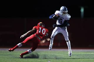 Centennial wide receiver Gerick Robinson (6) dodges  Arbor View defensive back Devin Ramirez (10) during a game at Arbor View high school, Friday, Sept. 27, 2019.