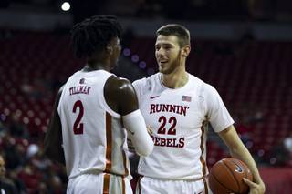 UNLV Rebel forward Vitaliy Shibel (22) congratulates Donnie Tillman (2) during an exhibition game against the West Coast Baptist College Eagles at the Thomas & Mack Center, Friday, Oct. 25, 2019.