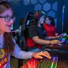 Valeria Falcon, left, a Roy Martin Middle school student, tries out "Fortnite," an online video game, during a Battle Born Girls Innovate tour at the HyperX Esports Arena Las Vegas at the Luxor Wednesday, Oct. 30, 2019. 