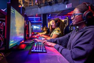 Roy Martin Middle school students Jaelina Richardson, left, and Alaysia Brown play Fortnite, an online video game, during a Battle Born Girls Innovate tour at the HyperX Esports Arena Las Vegas in the Luxor Wednesday, Oct. 30, 2019. Battle Born Girls Innovate, an educational program for middle and high school girls, was founded by the UNLV International Gaming Institute.