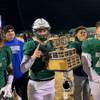 Green Valley quarterback Garrett Castro is shown with the Henderson Bowl trophy after the Gators defeated Basic on Friday, Nov. 1, 2019.
