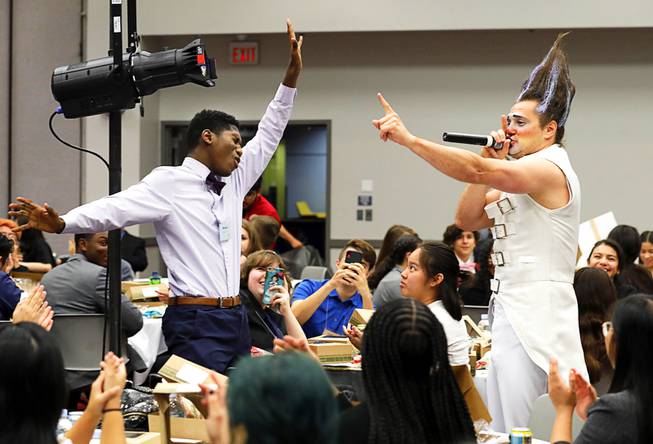 Meahel Pitra, left, of the Las Vegas Academy, shows off his vocal skills with Celestia clown Pavel Mikhaylov at a lunch break during the 2019 Las Vegas Sun Youth Forum at the Las Vegas Convention Center Wednesday, Nov. 13, 2019. Performers from the Stratosphere's Celestia show provided the lunchtime entertainment. 