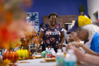 Joann Woods dances during a North Las Vegas Police community engagement event at Rose Garden Senior Apartments, Wednesday, Nov. 13, 2019. As part of the event, officers served an early Thanksgiving feast to local seniors.