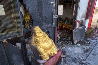Fire damage s shown at a shrine at the Wat Buddha Pavana Buddhist temple in North Las Vegas Tuesday, Dec. 17, 2019. Authorities are continuing to investigate what prompted a man to set fires at the temple S and shoot at a fleeing monk before killing himself Sunday night.
