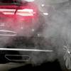 A car is surrounded by exhaust gases in this Wednesday, Nov. 20, 2019, file photo.