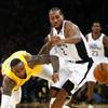 Los Angeles Lakers' LeBron James, left, and Los Angeles Clippers' Kawhi Leonard (2) chase the ball during the second half of an NBA basketball game Wednesday, Dec. 25, 2019, in Los Angeles. The Clippers won 111-106.