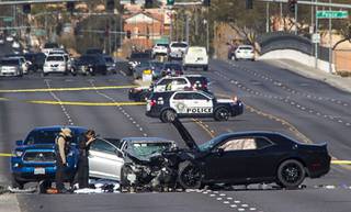 Metro Police crime scene analysts photograph a fatal accident on Fort Apache Road between Tropicana Avenue and Peace Way Saturday, Feb. 1, 2020. Two occupants in one vehicle died and the occupant of the other vehicle is in critical condition, police said.
