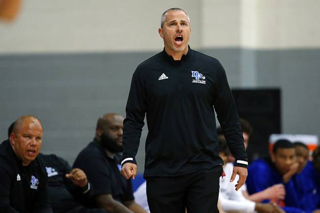 Desert Pines head coach Michael Uzan calls out to players during the Class 4A Mountain Region championship game against Faith Lutheran at Desert Pines High School Thursday, Feb. 20, 2020. The Desert Pines Jaguars beat the Faith Lutheran Crusaders 74-55.