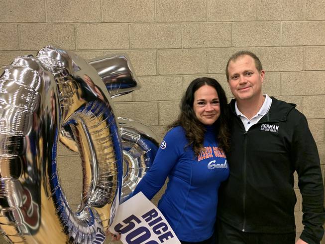 Bishop Gorman basketball coach Grant Rice celebrates with his wife, Brooke, after winning his 500th career game Feb. 20, 2020, in the Desert Regional championship game against Durango.
