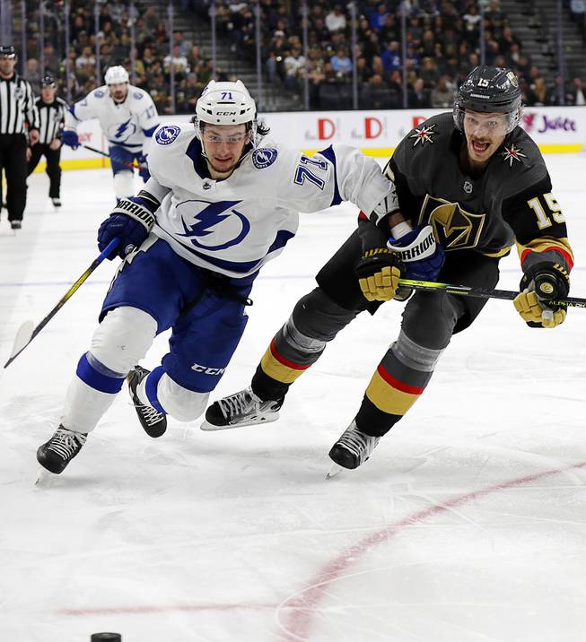 Tampa Bay Lightning forward Anthony Cirelli (71) skates to the puck as Vegas Golden Knights right wing Reilly Smith (19) defends during the third period of an NHL hockey game Thursday, Feb. 20, 2020, in Las Vegas. The Golden Knights won 5-3.
