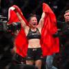 UFC women's strawweight champion Weili Zhang of China celebrates her split decision victory over former champion Joanna Jedrzejczyk of Poland during UFC 248 at T-Mobile Arena in Las Vegas Saturday, March 7, 2020.