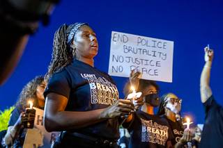 People rally in Kianga Isoke Palacio Park (formerly Doolittle Park) Friday, June 5, 2020. The peaceful rally and candlelight vigil against police brutality was one of many sparked by the outrage of the killing of George Floyd while in Minneapolis Police custody on Memorial Day.