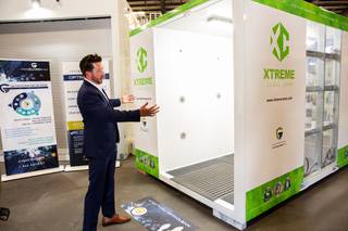 Brandon Main, CEO of Xtreme Manufacturing, speaks on the process behind their new Xtreme Opti-Clean Cube, a portable 360 degree walk-through disinfecting machine that utilizes an all-natural dry mist, Monday, June 22, 2020.