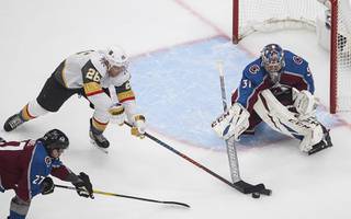 Colorado Avalanche goalie Philipp Grubauer (31) stops Vegas Golden Knights' Paul Stastny (26) during the first period of an NHL Stanley Cup qualifying round game in Edmonton, Alberta, Saturday, Aug. 8, 2020.