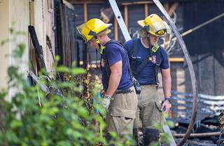 Clark County firefighters work at the scene of a fatal fire near Sahara Avenue and Boulder Highway Saturday, Aug. 29, 2020. One person was found dead in the home. The cause of the fire is under investigation.