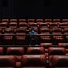 A moviegoer waits for a film to start at a movie theater in the Las Vegas area on Aug. 27, 2020. Most multiplexes around the country have been empty during the pandemic, but theater companies hope new releases will bring audiences back.