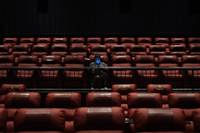 The Regal Sunset Station multiplex in Henderson reopened Thursday night after sitting empty for five months in eerie pandemic-forced exile. One of the first people to take a center seat, popcorn and orange soda in hand, was Brian Truitt, who bought tickets to ...