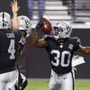 Las Vegas Raiders running back Jalen Richard (30) celebrates with quarterback Derek Carr (4) and wide receiver Bryan Edwards (89) in the end zone after scoring a touchdown in the second half of the Raiders' first home game against the New Orleans Saints at Allegiant Stadium Monday, Sept. 21, 2020.