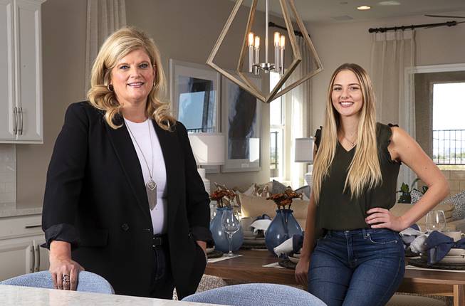 Nicole Bloom, left, division president for Richmond American Homes, and Kara Combs, senior department coordinator, pose in a model home in the Tessitura at Cadence community in Henderson Friday, Oct. 2, 2020.