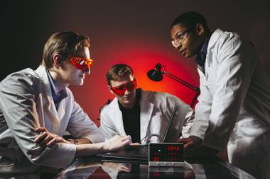 The Promethium team, from left, Chief Operating Officer Daniel Werth, Chief Technology Officer Devon Scheg and Chief Executive Officer Xavier Morgan-Lange pose for a photo in their lab, Monday, Nov. 30, 2020.
