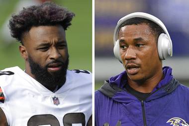 At left in a Dec. 6, 2020, photo, Cleveland Browns wide receiver Jarvis Landry warms up before an NFL football game against the Tennessee Titans in Nashville, Tenn. At right in a Sept. 28, 2020, photo, Baltimore Ravens cornerback Marcus Peters warms up before an NFL football game against the Kansas City Chiefs in Baltimore. Browns wide receiver Jarvis Landry called Ravens cornerback Marcus Peters “a coward” for appearing to spit at him during Monday night’s, Dec. 14 game. A video taken from the national TV broadcast shows Peters spitting in Landry’s direction at the end of the first quarter.