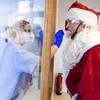 In this Dec. 21, 2020, file photo, Tessa Boulton, left, takes a swab test from Michael Kruse, dressed as Santa Claus, at a coronavirus testing center at the Helios Clinic in Schwerin, Germany.
In this Dec. 21, 2020, file photo, Tessa Boulton, left, takes a swab test from Michael Kruse, dressed as Santa Claus, at a coronavirus testing center at the Helios Clinic in Schwerin, Germany.