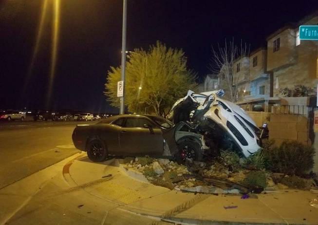 This photo provided by Metro Police shows the aftermath of a fatal car crash at Fort Apache Road and Furnace Gulch Avenue on Wednesday, Dec. 30, 2020.
