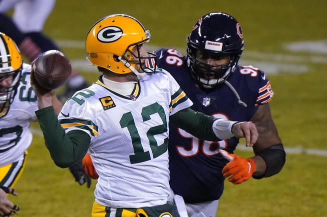 Green Bay Packers' Aaron Rodgers throws a pass during the second half of an NFL football game against the Chicago Bears Sunday, Jan. 3, 2021, in Chicago. 