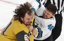 Vegas Golden Knights right wing Mark Stone (61) takes a punch from San Jose Sharks center Tomas Hertl (48) in the third period at T-Mobile ...