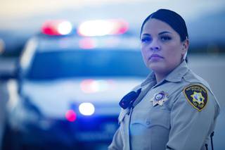 Metro Officer and Law Enforcement Explorer Program graduate Alexis Hodler poses for a photo at LVMPD Headquarters, Wednesday, March 17, 2021.