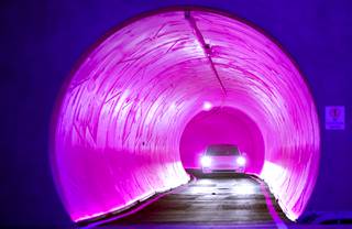 A Tesla electric car heads through a tunnel during a tour of Elon Musk's underground transportation system under the Las Vegas Convention Center Friday, April 9, 2021. The Las Vegas Convention Center Loop is the first commercial endeavor for Musk's Boring Company.
