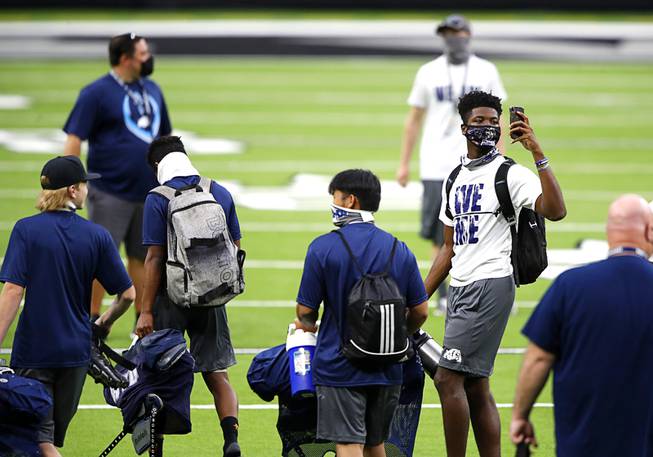 Centennial High School football players arrive for practice at Allegiant Stadium Friday, April 23, 2021. Nine high school teams were selected to hold practices in the stadium, home to the Las Vegas Raiders.