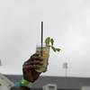 A Mint Julep is raised in the air at Churchill Downs before the 145th running of the Kentucky Derby horse race Saturday, May 4, 2019, in Louisville, Ky.