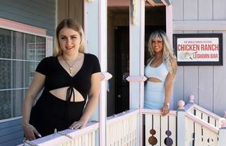 Legal prostitutes Kourney Chase, left, and Ariel Ganja pose at the Chicken Ranch brothel in Pahrump, Nev. Thursday, May 6, 2021. Nevada's legal brothels reopened Saturday, May 1 after being closed for more than a year due to the COVID-19 pandemic.