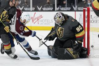 Colorado Avalanche left wing J.T. Compher (37) scores a goal against Vegas Golden Knights goaltender Robin Lehner (90) during the third period of an NHL hockey game Monday, May 10, 2021, in Las Vegas. 