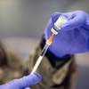 A Nevada National Guard member fills a syringe with vaccine at a vaccination center in the Las Vegas Convention Center's South Hall Thursday, May 13, 2021.
