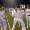 An Elvis Presley impersonator who identified himself only as “Reno” demonstrates a few of his moves for Oakland A’s, from left, coach Bob Alejo, and infielders Mike Bordick and Brent Gates, before the start of their Opening Day game April 1, 1996, against the Toronto Blue Jays at Cashman Field in Las Vegas. The A’s played their first six “home” games at Cashman Field while the Oakland Coliseum was undergoing renovations.