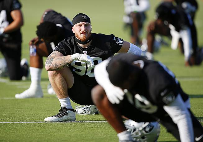 Las Vegas Raiders defensive end Maxx Crosby (98) stretches during a practice at the Raiders facility in Henderson Tuesday, June 15, 2021.